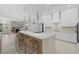 Modern kitchen with white cabinets, quartz countertops, and a large island at 4611 Shark Dr, Bradenton, FL 34208