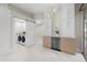Bright laundry room with modern washer and dryer, and barn door at 4611 Shark Dr, Bradenton, FL 34208