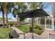 Peaceful patio with water views and striped rug at 4611 Shark Dr, Bradenton, FL 34208