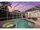 Enclosed pool and spa with seating area at 4611 Shark Dr, Bradenton, FL 34208