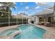 Large screened pool and spa with patio seating at 4611 Shark Dr, Bradenton, FL 34208
