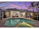 Enclosed pool and spa with view of home at 4611 Shark Dr, Bradenton, FL 34208