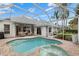 Resort-style pool and spa with covered patio at 4611 Shark Dr, Bradenton, FL 34208