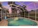 Enclosed pool and spa area with brick pavers at 4611 Shark Dr, Bradenton, FL 34208