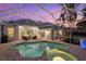 Inviting swimming pool and spa with a covered patio at 4611 Shark Dr, Bradenton, FL 34208