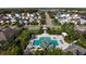 Aerial view of community with pool and houses at 4720 Woodbrook Dr, Sarasota, FL 34243