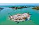 Amazing aerial view showcasing a tranquil island surrounded by azure waters, ideal for boat lovers at 482 Rubens Dr E, Nokomis, FL 34275
