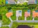 Bird's eye view showing homes with pools, manicured lawns, and landscaping at 482 Rubens Dr E, Nokomis, FL 34275