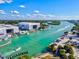 Expansive aerial view of a marina with boat docks, large storage, and beautiful waterway views at 482 Rubens Dr E, Nokomis, FL 34275