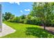 The lush green backyard offers plenty of space for outdoor activities and relaxation at 482 Rubens Dr E, Nokomis, FL 34275