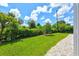 Well-maintained backyard featuring lush green grass, perfect for relaxation and outdoor activities at 482 Rubens Dr E, Nokomis, FL 34275