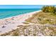 Aerial view of the pristine beach and the Gulf of Mexico at 482 Rubens Dr E, Nokomis, FL 34275
