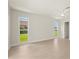 Inviting bedroom features natural light and views of the yard through dual windows at 482 Rubens Dr E, Nokomis, FL 34275