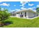 Exterior view showing the pool area and well-maintained backyard with lush landscaping at 482 Rubens Dr E, Nokomis, FL 34275