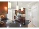 Spacious kitchen with granite countertops, dark wood cabinets, and stainless steel appliances at 482 Rubens Dr E, Nokomis, FL 34275