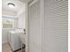 Bright laundry room with washer, dryer and window at 482 Rubens Dr E, Nokomis, FL 34275