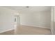 Open-concept living room featuring new floors, fresh paint, and a view of the screened-in pool at 482 Rubens Dr E, Nokomis, FL 34275