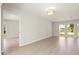 Bright living room featuring large windows that offer ample natural light and neutral walls at 482 Rubens Dr E, Nokomis, FL 34275