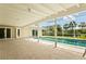 Covered patio with pool views at 482 Rubens Dr E, Nokomis, FL 34275