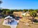 Community playground with covered picnic tables, swings, and view of water at 482 Rubens Dr E, Nokomis, FL 34275