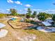 Community playground featuring swings, picnic tables, and play equipment at 482 Rubens Dr E, Nokomis, FL 34275