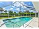 A beautiful in-ground pool with screen enclosure for comfortable, year-round enjoyment at 482 Rubens Dr E, Nokomis, FL 34275