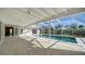 Relaxing pool area with covered patio and screened enclosure at 482 Rubens Dr E, Nokomis, FL 34275