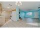 Open kitchen with light wood cabinets and tile floors at 5194 Island Date St, Sarasota, FL 34232