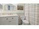 Bathroom featuring white vanity, framed mirror, and a shower/tub with patterned curtain at 5307 52Nd W Ave, Bradenton, FL 34210