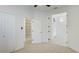 Light-filled bedroom featuring a closet and walk-in storage with an adjacent door leading to another room at 5307 52Nd W Ave, Bradenton, FL 34210