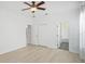 Bedroom with an ensuite bathroom featuring neutral decor and a ceiling fan at 5307 52Nd W Ave, Bradenton, FL 34210