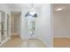 Bright foyer featuring a chandelier, white walls, and a glass door entryway at 5307 52Nd W Ave, Bradenton, FL 34210