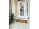 Inviting front door entrance with decorative wreath, welcome mat, and a charming potted plant, creating a warm and welcoming atmosphere at 5307 52Nd W Ave, Bradenton, FL 34210