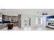 Modern living area featuring a fireplace with a TV, and an open-concept design at 5307 52Nd W Ave, Bradenton, FL 34210