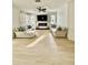 Spacious living room featuring a fireplace, TV, and comfortable sofas at 5307 52Nd W Ave, Bradenton, FL 34210