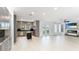 Open floor plan featuring gray cabinets, black backsplash and stainless appliances at 5307 52Nd W Ave, Bradenton, FL 34210