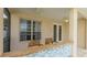 Outdoor patio area with bar seating, a ceiling fan and access to the backyard at 5307 52Nd W Ave, Bradenton, FL 34210