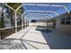 Screened-in pool and patio area, surrounded by lush landscaping and views of the adjacent lake at 5307 52Nd W Ave, Bradenton, FL 34210