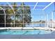 The pool in a screened enclosure with a peaceful lake view at 5307 52Nd W Ave, Bradenton, FL 34210