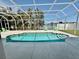 Inviting screened-in pool with clear blue water, lounge chairs, and a view of the lake at 5307 52Nd W Ave, Bradenton, FL 34210