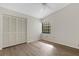 Bright bedroom with ceiling fan and large closet at 5535 Hampstead Heath # 45, Sarasota, FL 34235