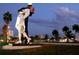 Iconic Unconditional Surrender statue at sunset with palm trees and marina at 5535 Hampstead Heath # 45, Sarasota, FL 34235