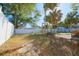 Backyard with a brick path, shed, and tall trees at 5611 26Th W St, Bradenton, FL 34207