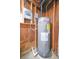 Unfinished basement with water heater and electrical panel at 5611 26Th W St, Bradenton, FL 34207
