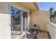 Private balcony with table and chairs, offering a relaxing outdoor space at 6101 34Th W St # 19H, Bradenton, FL 34210