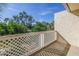 Private balcony featuring a white lattice fence and treetop views at 6101 34Th W St # 19H, Bradenton, FL 34210