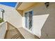 Peaceful balcony space with white lattice railing and sliding door access at 6101 34Th W St # 19H, Bradenton, FL 34210