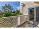 Outdoor balcony with a glass table and chairs plus leafy views at 6101 34Th W St # 19H, Bradenton, FL 34210