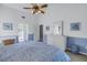 Bright bedroom with king-size bed and dresser at 6101 34Th W St # 19H, Bradenton, FL 34210