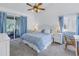 Spacious bedroom with king-size bed and access to a balcony at 6101 34Th W St # 19H, Bradenton, FL 34210